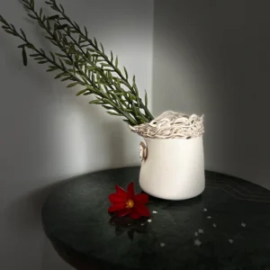 A touch of rustic charmThis unique ceramic vase is a perfect blend of rustic and modern. The hand-built texture and warm glaze create a cozy and inviting feel while the simple form adds a touch of elegance.