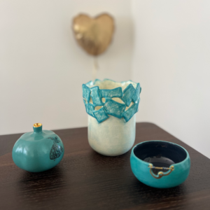 This stunning set of three ceramic pieces is a true work of art. The unique shapes, vibrant colors, and intricate details make them stand out from the crowd. Perfect for adding